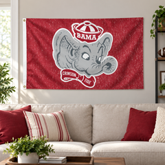 Alabama vintage elephant-head flag displayed above a fan-room sofa — lifestyle visualization