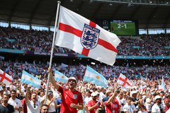 England Three Lions crest flag on a pole at a World Cup match vs Argentina