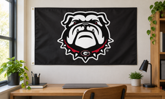 Georgia Bulldogs bulldog-head black flag above a dorm-room desk — lifestyle visualization