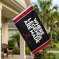 Alabama Crimson Tide Where Legends Are Made flag displayed from a porch flagpole at a coastal Florida home.