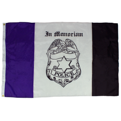 Flag with police badge and 'In Memoriam' text on a purple, white, and black striped background
