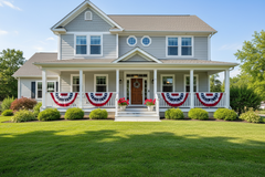 Stylish house with decorative flags and flowers on a sunny day