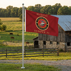 Semper Fi flag flying from a 20-foot pole on a farm